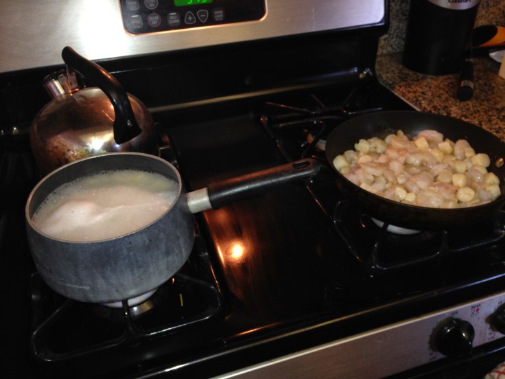 Spaghetti cooking along with shrimp & scallops while the oven pre-heats